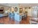 Open-concept kitchen featuring a spacious island with bar seating, perfect for entertaining guests at 214 Palette Ln, Peachtree City, GA 30269