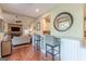 Stylish open kitchen with bar seating and seamless flow into the inviting living area at 214 Palette Ln, Peachtree City, GA 30269