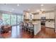 Spacious kitchen with a center island, stainless steel appliances, and sliding glass doors leading to outdoor space at 214 Palette Ln, Peachtree City, GA 30269