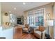 Bright living area with armchairs and windows offering serene backyard views at 214 Palette Ln, Peachtree City, GA 30269