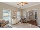 Cozy living room with neutral colors, large windows, and natural light at 214 Palette Ln, Peachtree City, GA 30269