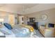 Beautiful primary suite featuring a ceiling fan, TV, walk-in closet and a sitting area near a large window at 214 Palette Ln, Peachtree City, GA 30269