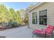 Outdoor patio seating area with a grill and view of backyard landscaping at 214 Palette Ln, Peachtree City, GA 30269