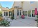 Back patio with access to house and view of mature greenery and landscaping at 214 Palette Ln, Peachtree City, GA 30269