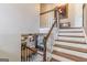 Elegant staircase with wooden treads and white risers, providing access to the upper level of the home at 214 Palette Ln, Peachtree City, GA 30269