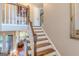 Classic staircase design with wooden railing and white spindles, adding charm to the home's interior at 214 Palette Ln, Peachtree City, GA 30269