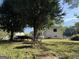 Backyard featuring mature trees with additional space for activities at 610 Tower Rd, Peachtree City, GA 30269