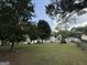 Large backyard with mature trees and a mix of vegetation at 610 Tower Rd, Peachtree City, GA 30269
