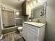 This bathroom has a vanity with a granite countertop and a shower-tub combo at 610 Tower Rd, Peachtree City, GA 30269