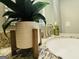 The bathroom has a nice sink with granite countertop and a decorative faux plant at 610 Tower Rd, Peachtree City, GA 30269