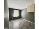 This bedroom has lovely, gray wood-look flooring and a window for great natural light at 610 Tower Rd, Peachtree City, GA 30269