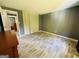 Spacious bedroom with light wood flooring and closet at 610 Tower Rd, Peachtree City, GA 30269