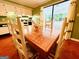 Bright dining area adjacent to the kitchen and sunroom at 610 Tower Rd, Peachtree City, GA 30269