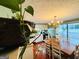 Cozy dining area featuring a chandelier and view to sunroom at 610 Tower Rd, Peachtree City, GA 30269