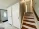 Foyer with stairs, closet and front door at 610 Tower Rd, Peachtree City, GA 30269