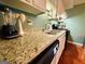 Kitchen with granite countertops and appliances at 610 Tower Rd, Peachtree City, GA 30269