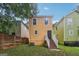View of the backyard featuring the exterior of the home and a small staircase at 1159 Smith Sw St, Atlanta, GA 30310