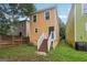 View of the backyard featuring the exterior of the home and a small staircase at 1159 Smith Sw St, Atlanta, GA 30310