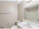 This bathroom features a shower/tub combo, single sink, and a large mirror at 1159 Smith Sw St, Atlanta, GA 30310