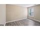 Bedroom with neutral walls, modern flooring, and a window at 1159 Smith Sw St, Atlanta, GA 30310