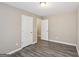 Bedroom with neutral walls, modern flooring, and two closets at 1159 Smith Sw St, Atlanta, GA 30310