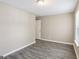 Bedroom with neutral walls, modern flooring, and a light fixture at 1159 Smith Sw St, Atlanta, GA 30310