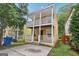 Charming yellow two-story home featuring double porches with white railings for outdoor enjoyment at 1159 Smith Sw St, Atlanta, GA 30310
