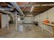 Unfinished basement space with concrete floors, exposed ceiling, and potential for storage or customization at 183 Inman Rd, Fayetteville, GA 30215