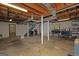 Expansive unfinished basement with ductwork, supporting pillars, and potential for future customization at 183 Inman Rd, Fayetteville, GA 30215
