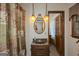 Well-lit bathroom featuring a stylish vanity with a marble countertop, and updated fixtures at 183 Inman Rd, Fayetteville, GA 30215