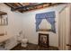 Functional basement bathroom with a sink, toilet, shower, and a framed picture to add character to the space at 183 Inman Rd, Fayetteville, GA 30215