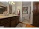 Bathroom featuring a marble countertop vanity, decorative tile, and a separate toilet room at 183 Inman Rd, Fayetteville, GA 30215