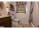 Comfortable bathroom with a granite vanity, shower/bath and decorative patterned tile floor at 183 Inman Rd, Fayetteville, GA 30215