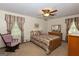 Cozy bedroom with traditional furnishings, ceiling fan, and a comfortable bed setting at 183 Inman Rd, Fayetteville, GA 30215
