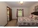 Comfortable bedroom featuring a bed, carpet, and a window that fills the space with lots of natural light at 183 Inman Rd, Fayetteville, GA 30215
