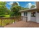 Inviting deck with unique sunburst design railing, ideal for relaxing in a private, tree-lined setting at 183 Inman Rd, Fayetteville, GA 30215
