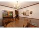 Elegant dining area with beautiful chandelier, wood furniture, and decorative moldings at 183 Inman Rd, Fayetteville, GA 30215