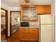 Kitchen area featuring upper cabinets with glass doors and granite countertops at 183 Inman Rd, Fayetteville, GA 30215