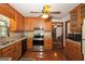 Well-lit kitchen boasts wooden cabinetry, stainless steel appliances, and tiled backsplash at 183 Inman Rd, Fayetteville, GA 30215