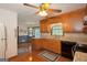 Traditional kitchen featuring wood cabinets, granite countertops, and hardwood flooring at 183 Inman Rd, Fayetteville, GA 30215