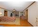 Spacious living room featuring a brick fireplace and hardwood floors at 183 Inman Rd, Fayetteville, GA 30215