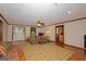 Open living room showcasing hardwood floors and a large area rug at 183 Inman Rd, Fayetteville, GA 30215