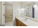 Bathroom with large mirror, vanity with sink, and a shower/tub combination at 5618 Shadow Rock Dr, Lithonia, GA 30058