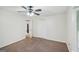 Bedroom with neutral walls, plush carpet, ceiling fan, and closet space at 5618 Shadow Rock Dr, Lithonia, GA 30058