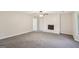 Cozy living room features a fireplace, new carpet, and plenty of natural light at 5618 Shadow Rock Dr, Lithonia, GA 30058