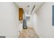 Utility room featuring water heater, laminate flooring, and a small window with blinds at 5618 Shadow Rock Dr, Lithonia, GA 30058