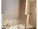 Bathroom featuring a soaking tub and a separated tiled shower area at 5908 Trent Jones Way, Lithonia, GA 30038