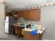 Kitchen with stainless steel refrigerator, wooden cabinets, and some counter space at 5908 Trent Jones Way, Lithonia, GA 30038