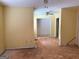Open-concept space featuring wall damage and peeling floor, awaiting restoration at 5908 Trent Jones Way, Lithonia, GA 30038