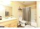 Bright bathroom with a tub-shower combo, neutral colors, and a double sink vanity at 190 Country Club Dr, Hiram, GA 30141